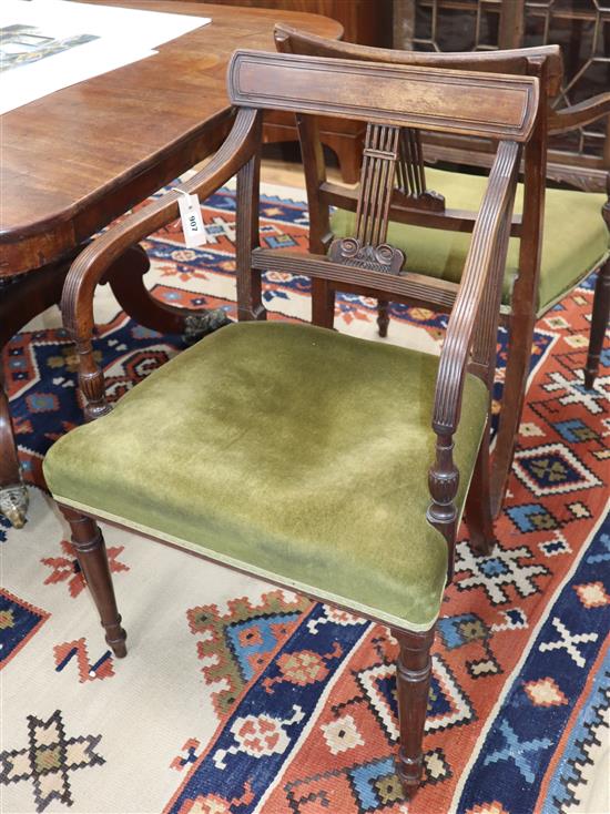 A pair of George III mahogany elbow chairs